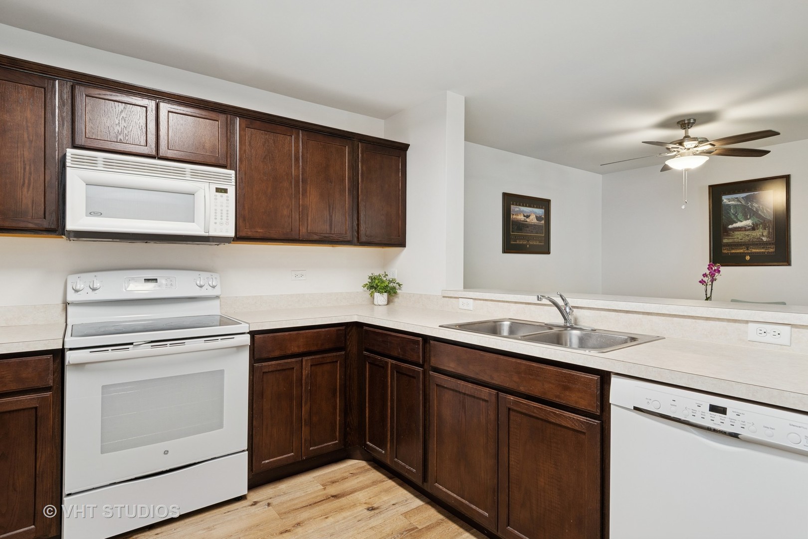 1504 McClure Road, Unit 1504 Aurora, IL 60505 - Photo 6 of 21 a kitchen with a sink stove and cabinets