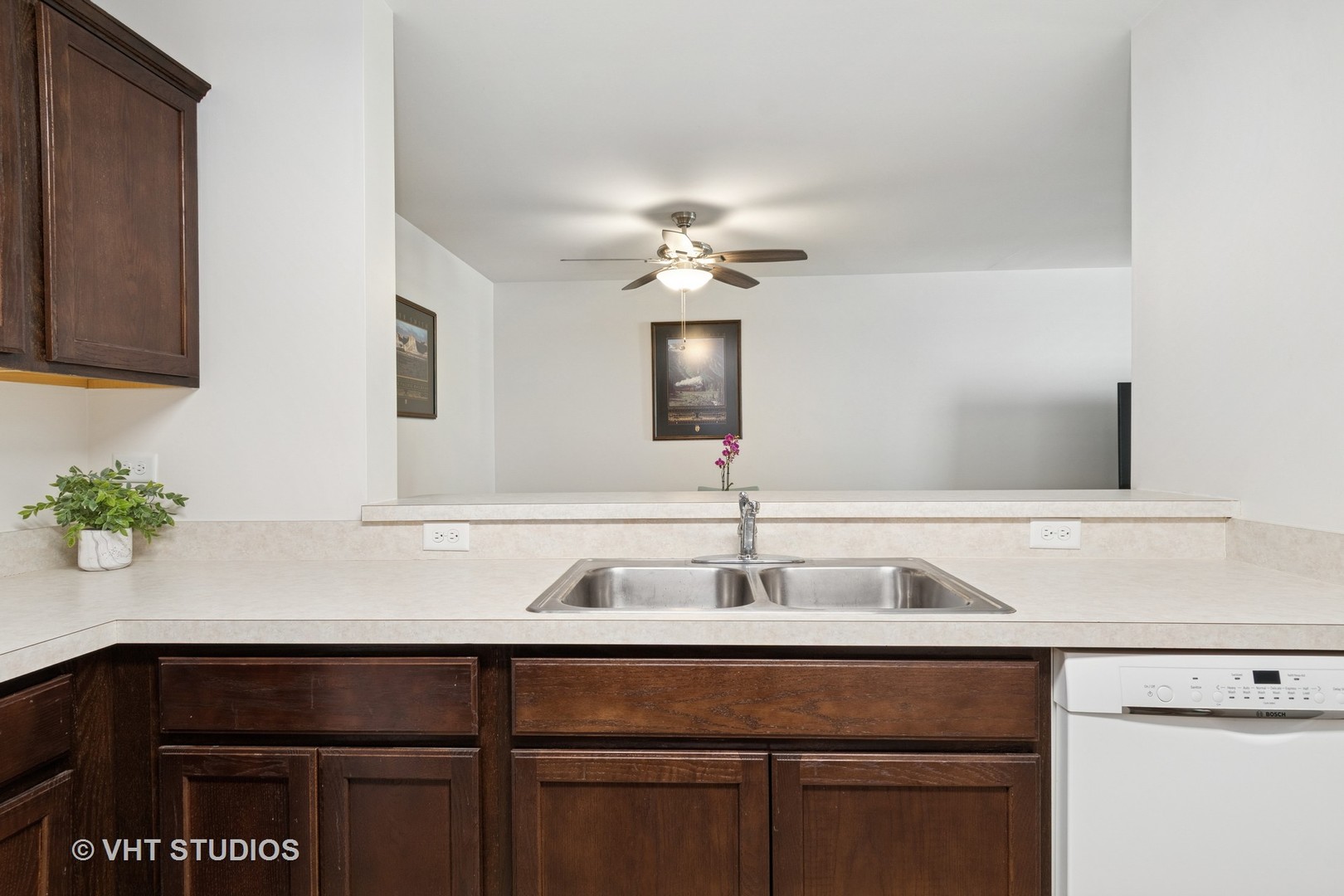 1504 McClure Road, Unit 1504 Aurora, IL 60505 - Photo 7 of 21 a sink with a potted plant on it