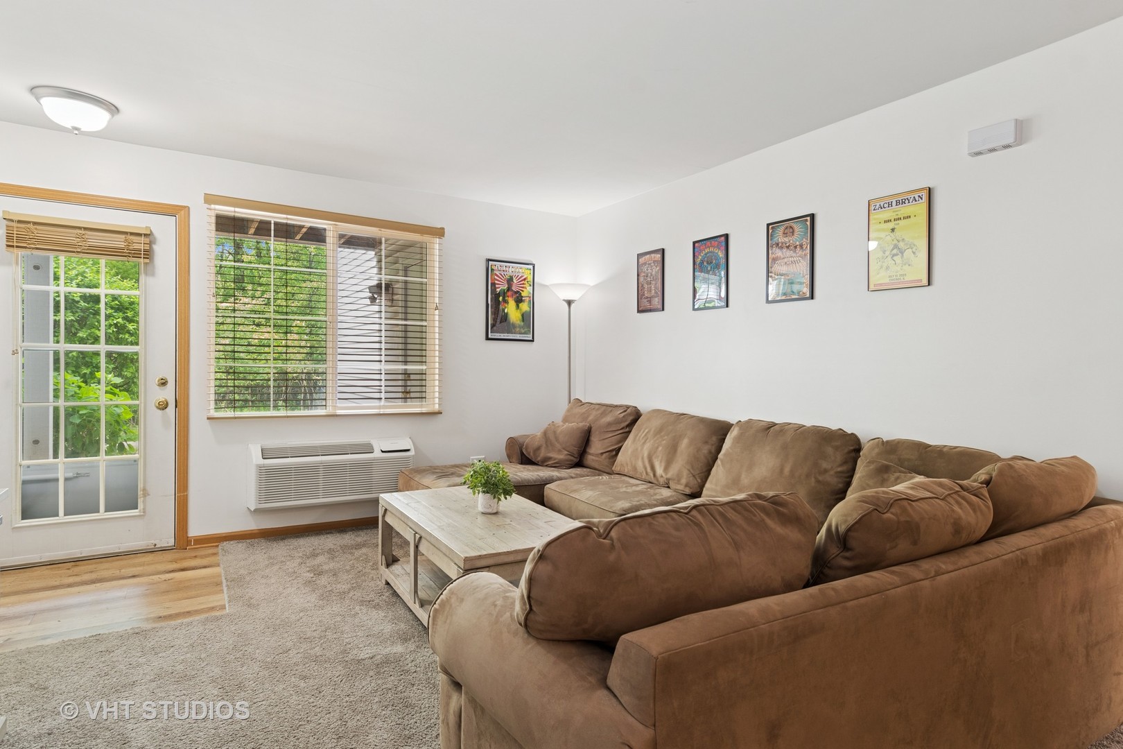 1504 McClure Road, Unit 1504 Aurora, IL 60505 - Photo 10 of 21 a living room with furniture and a window