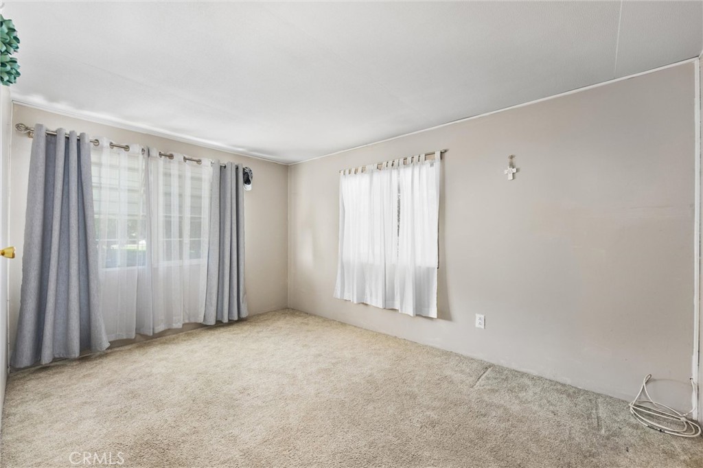 4730 Coronado Street West Bakersfield, CA 93314 - Photo 15 of 29 an empty room with windows