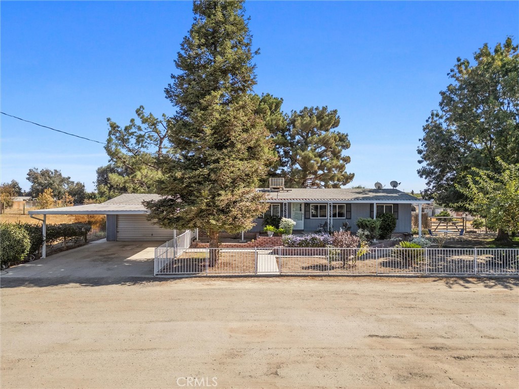 4730 Coronado Street West Bakersfield, CA 93314 - Photo 3 of 29 a house with trees in front of it