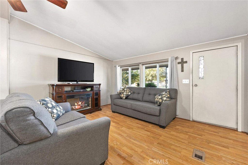 4730 Coronado Street West Bakersfield, CA 93314 - Photo 6 of 29 a living room with furniture and a flat screen tv
