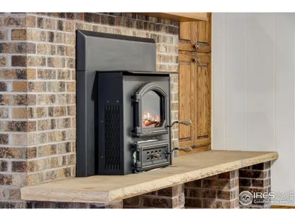 a living room with a table and a fireplace