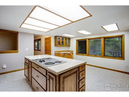 a kitchen that has a stove and a table in it