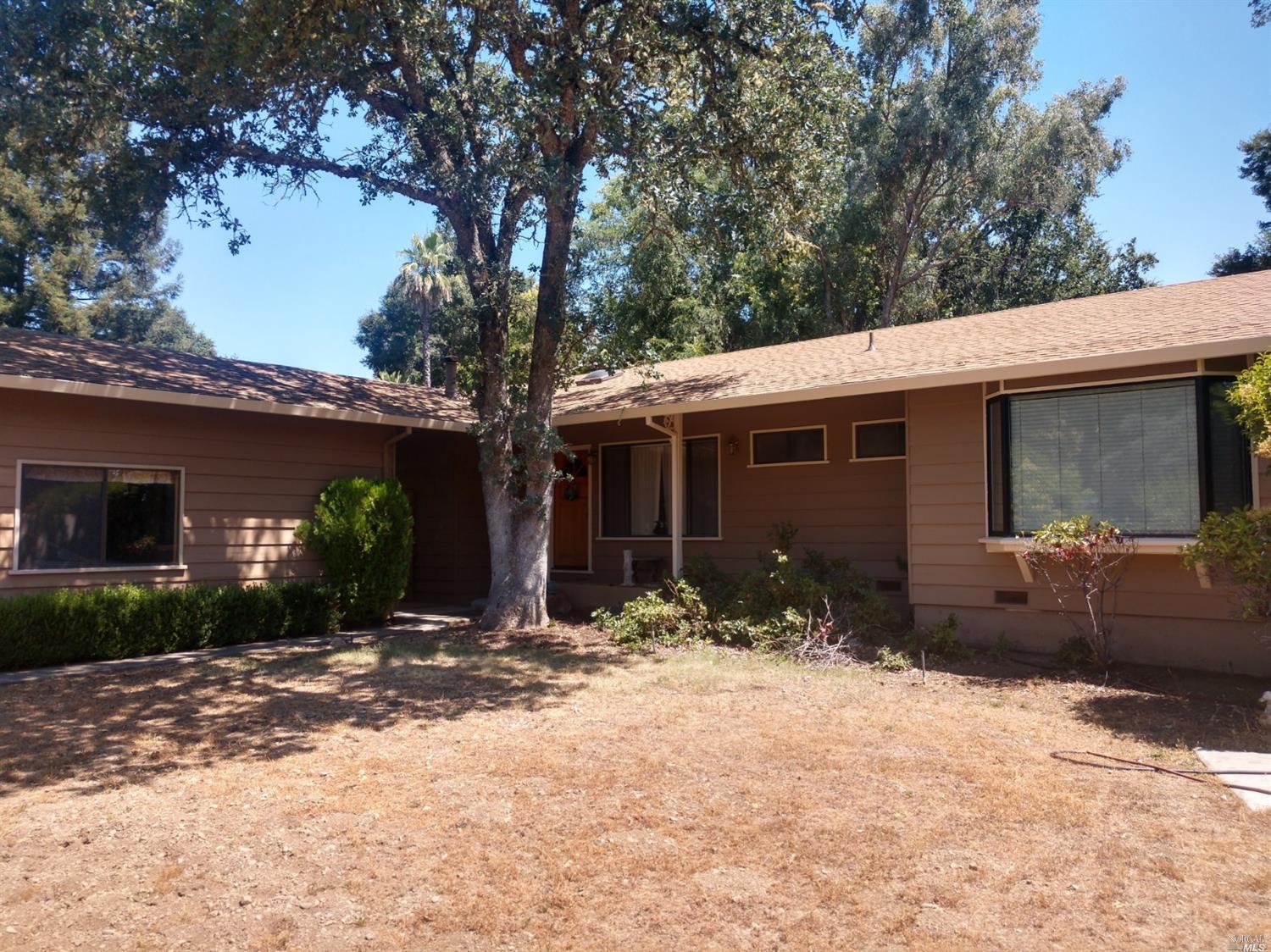 1120 Riverside Drive Ukiah, CA 95482 - Photo 1 of 1 a front view of a house with a yard and outdoor space