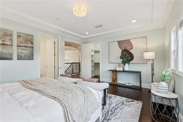 a bedroom with a bed a table and chair