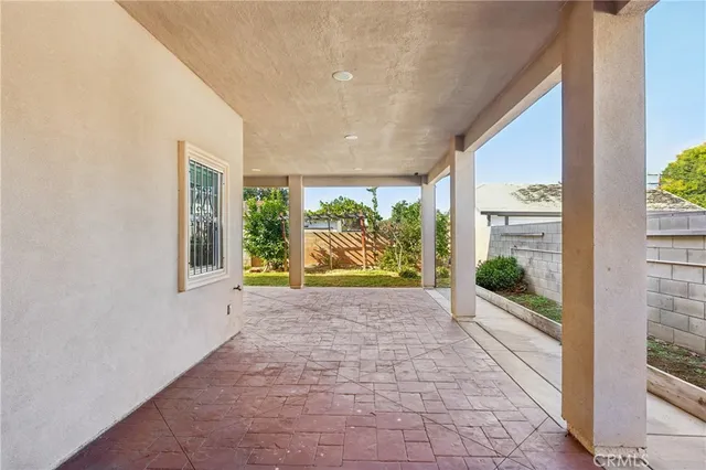 an aerial view of a house with garden space and street view