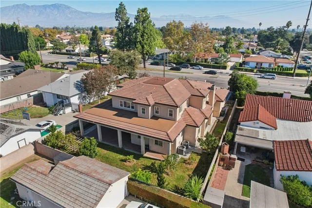 a view of residential houses with outdoor space and street view