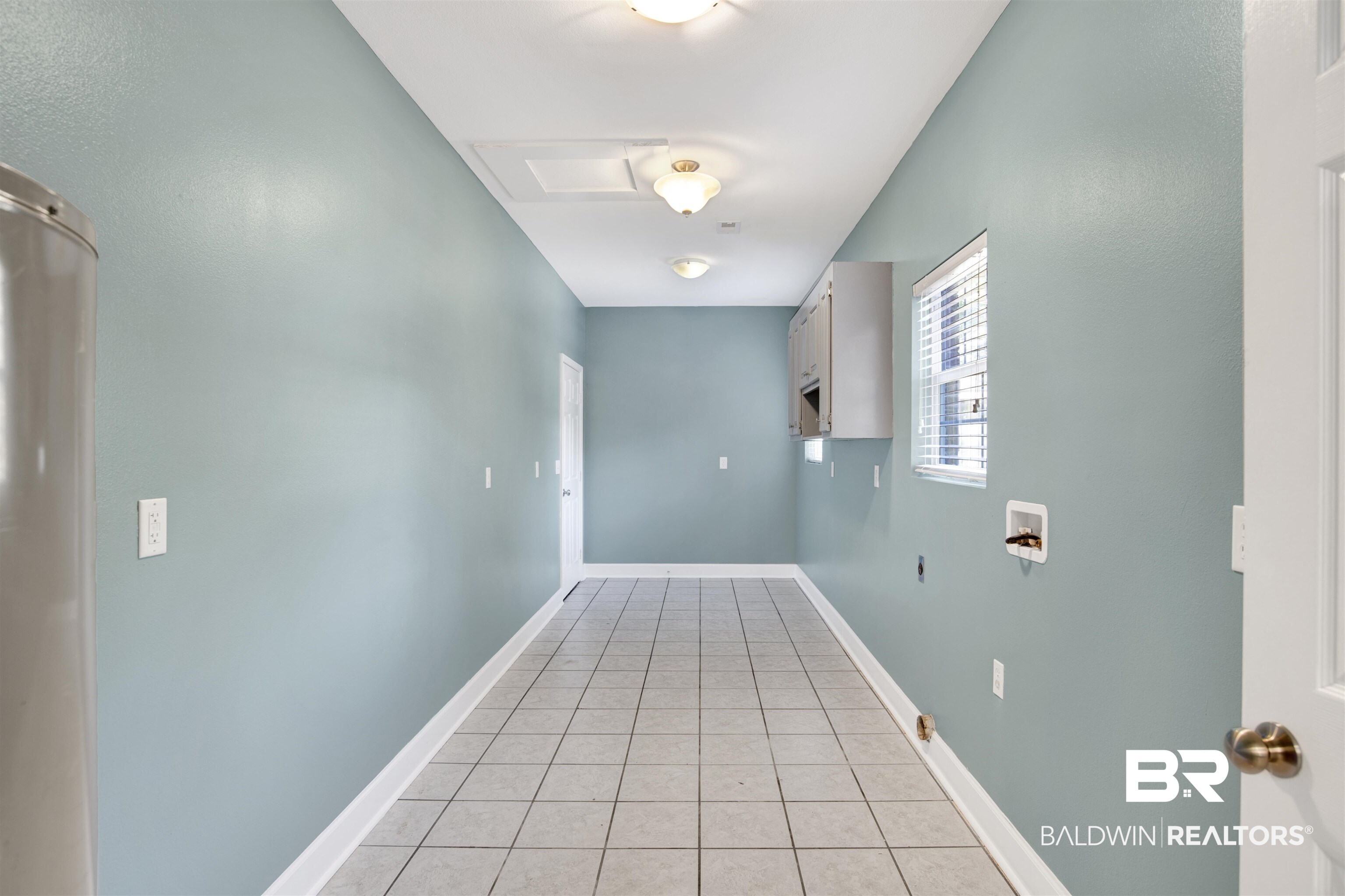 11835 Island Drive Foley, AL 36535 - Photo 39 of 53 Laundry room with light tile patterned floors, washer hookup, and water heater