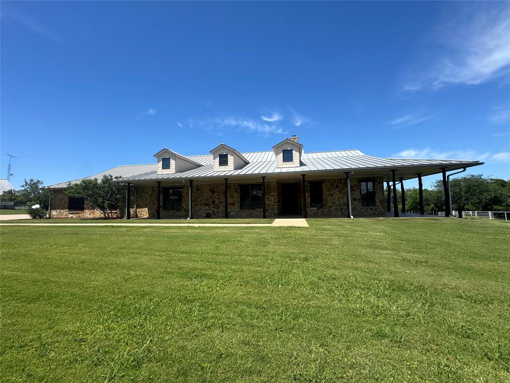 11918 Riek Road Krum, TX 76249 - Photo 2 of 40 a front view of a house with a garden