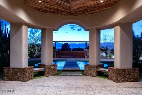 a view of a patio with chairs and a table