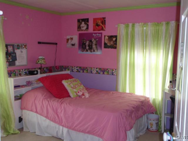 1049 Deemer Road Bath, PA 18014 - Photo 9 of 13 a bedroom with a bed and a painting on the wall