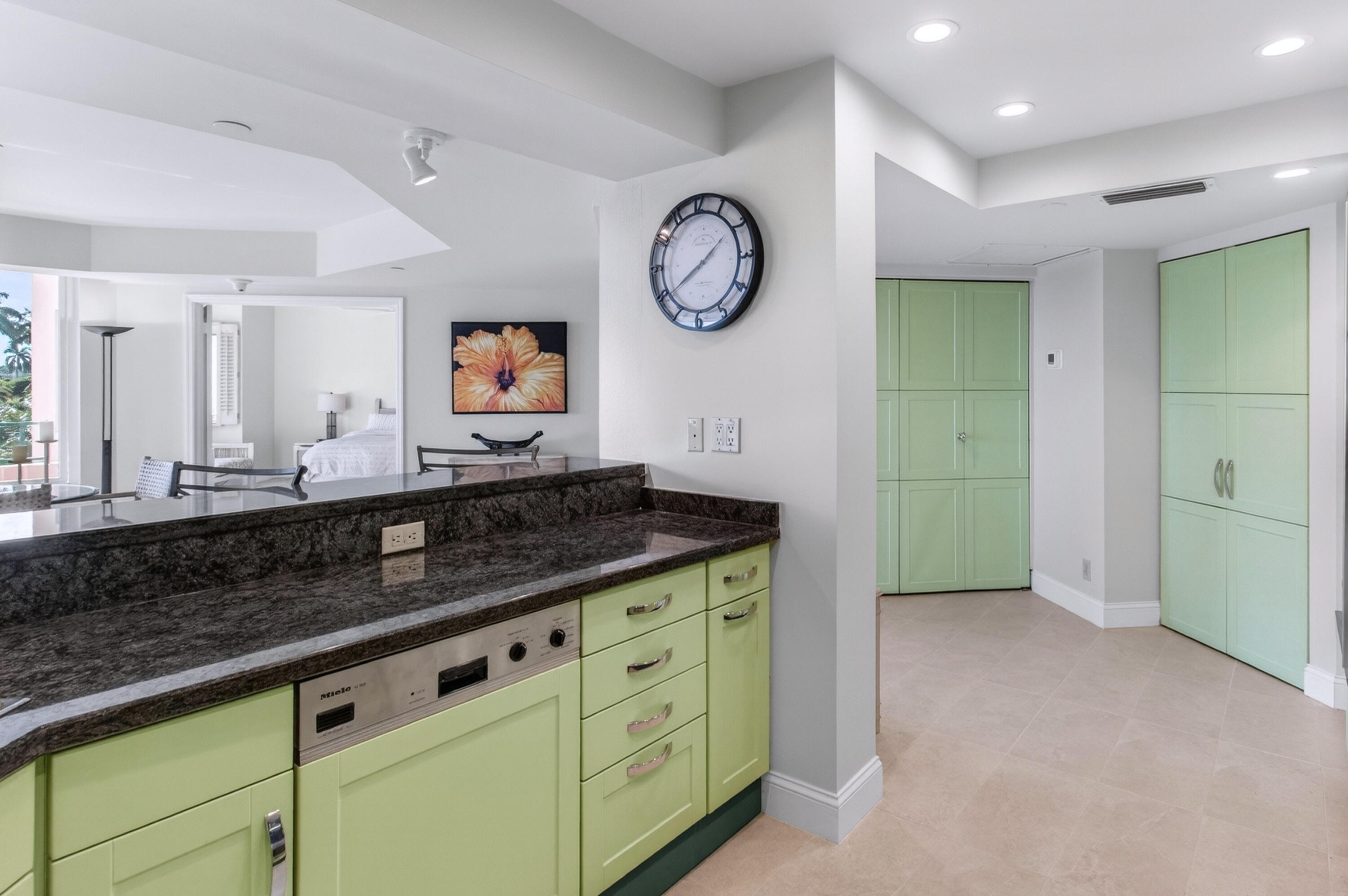 140 Southeast 5th Avenue, Unit 448 Boca Raton, FL 33432 - Photo 13 of 43 a spacious bathroom with a granite countertop sink and a large mirror