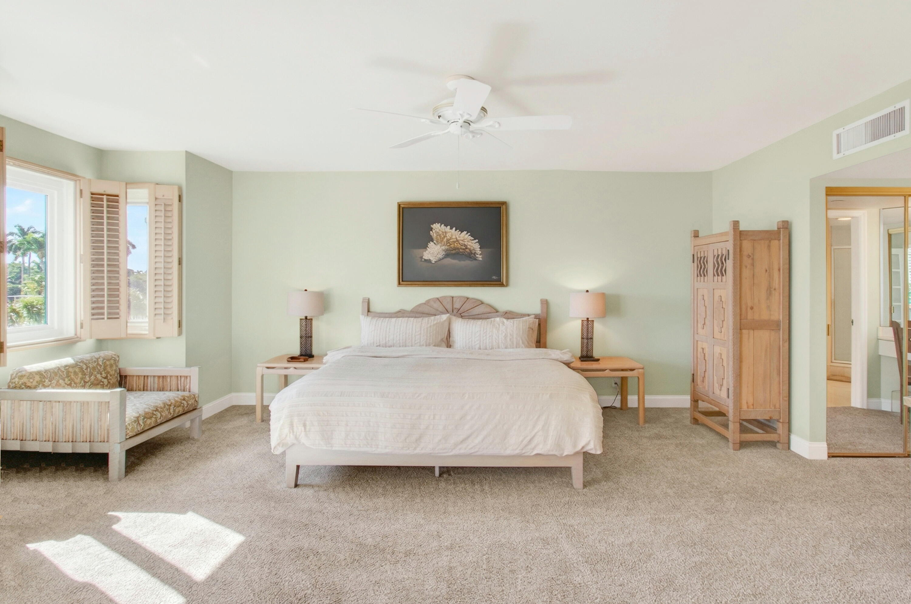 140 Southeast 5th Avenue, Unit 448 Boca Raton, FL 33432 - Photo 19 of 43 a spacious bedroom with a bed and a couch