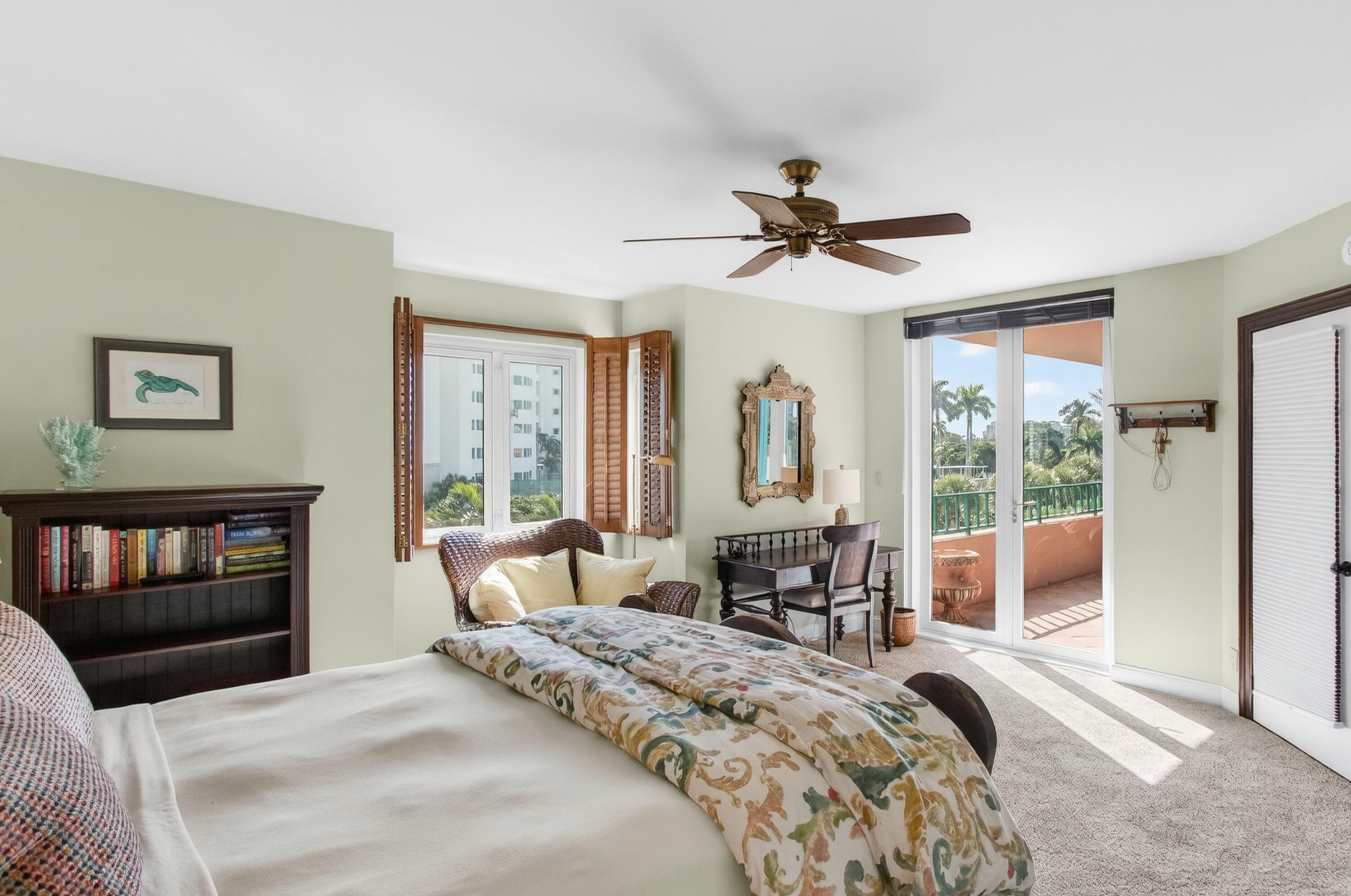 140 Southeast 5th Avenue, Unit 448 Boca Raton, FL 33432 - Photo 23 of 43 a bedroom with a bed and a chandelier