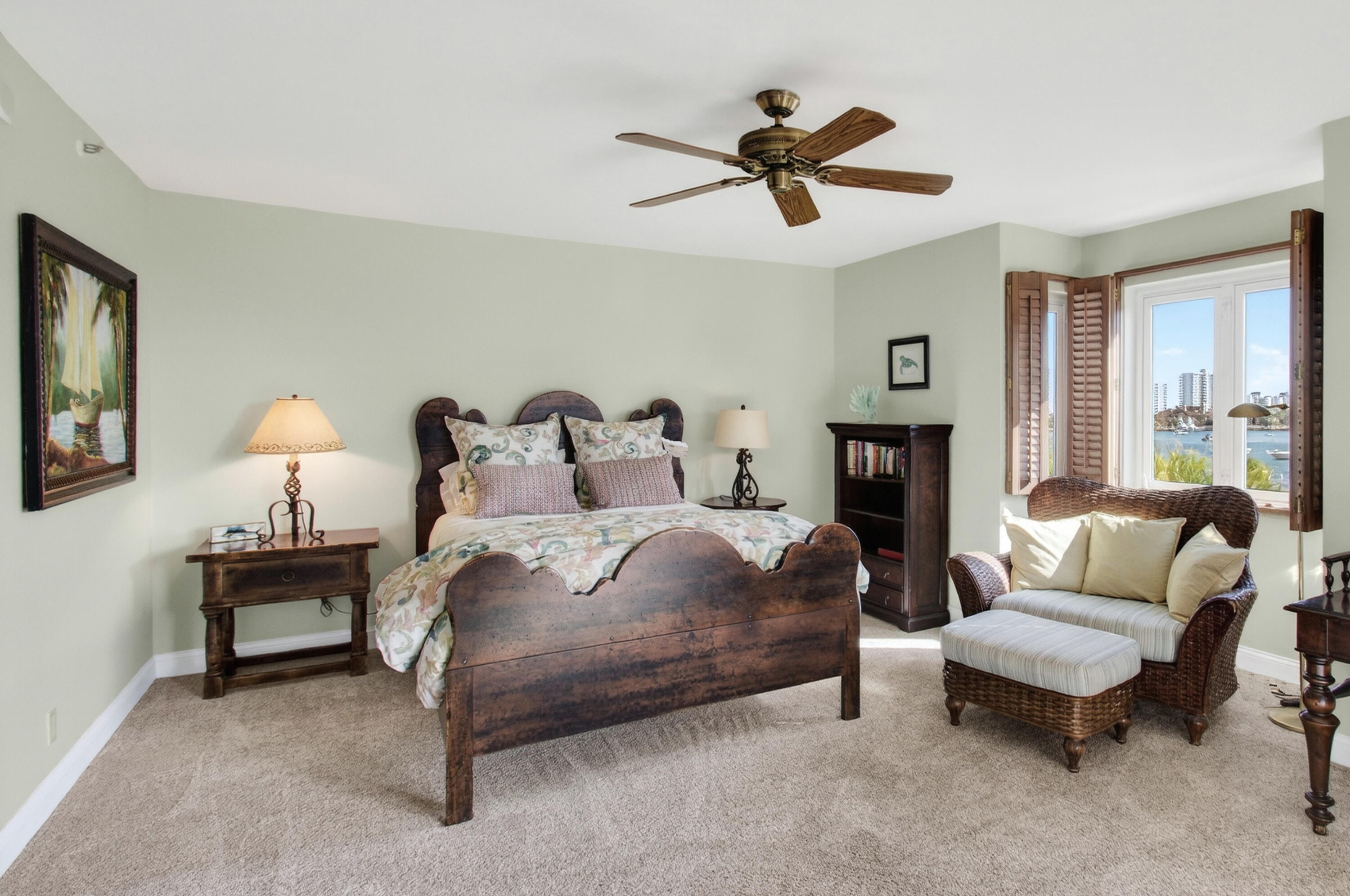 140 Southeast 5th Avenue, Unit 448 Boca Raton, FL 33432 - Photo 24 of 43 a spacious bedroom with a bed and a couch