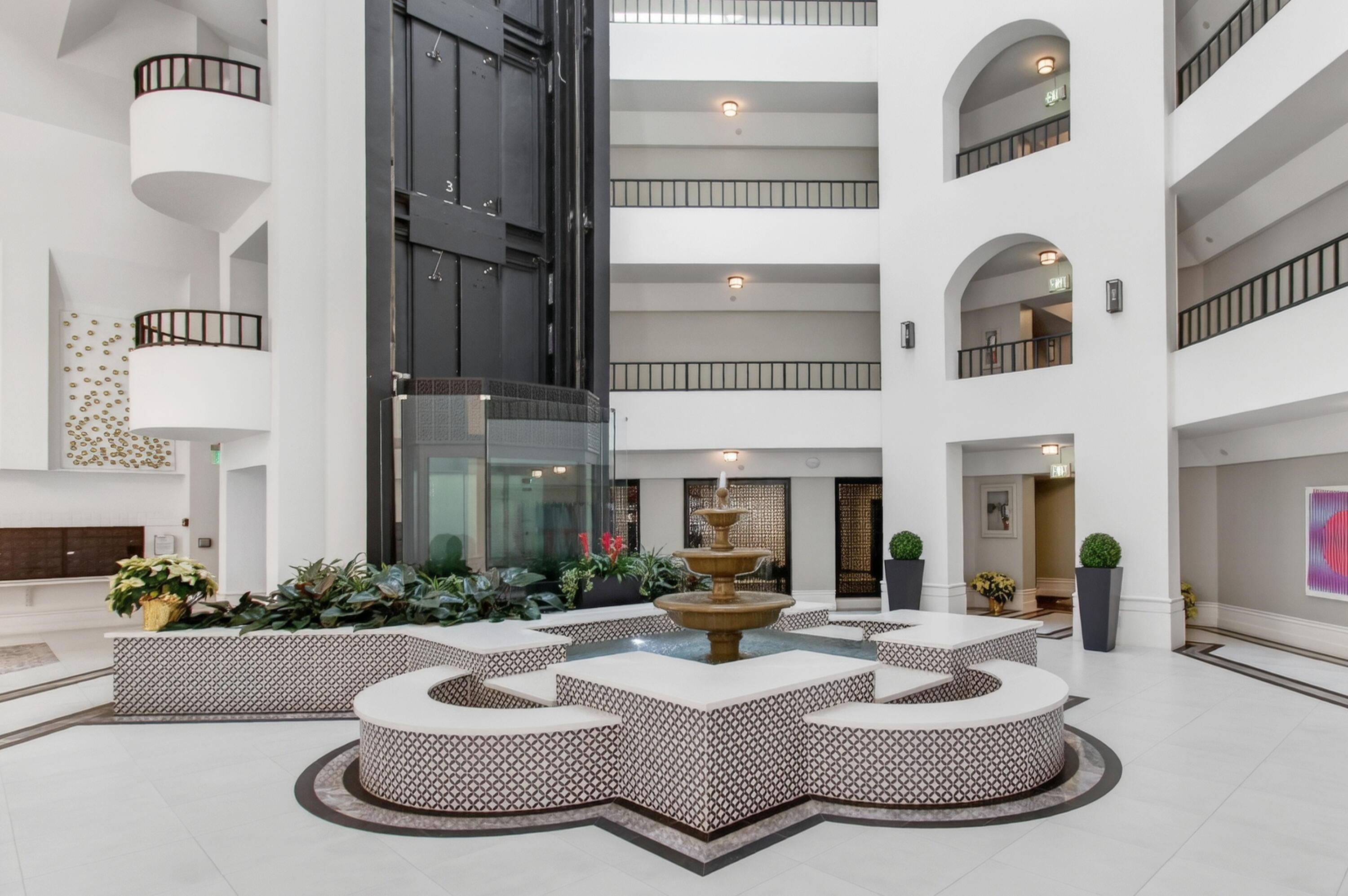 140 Southeast 5th Avenue, Unit 448 Boca Raton, FL 33432 - Photo 3 of 43 a living room with fireplace furniture and a wooden floor
