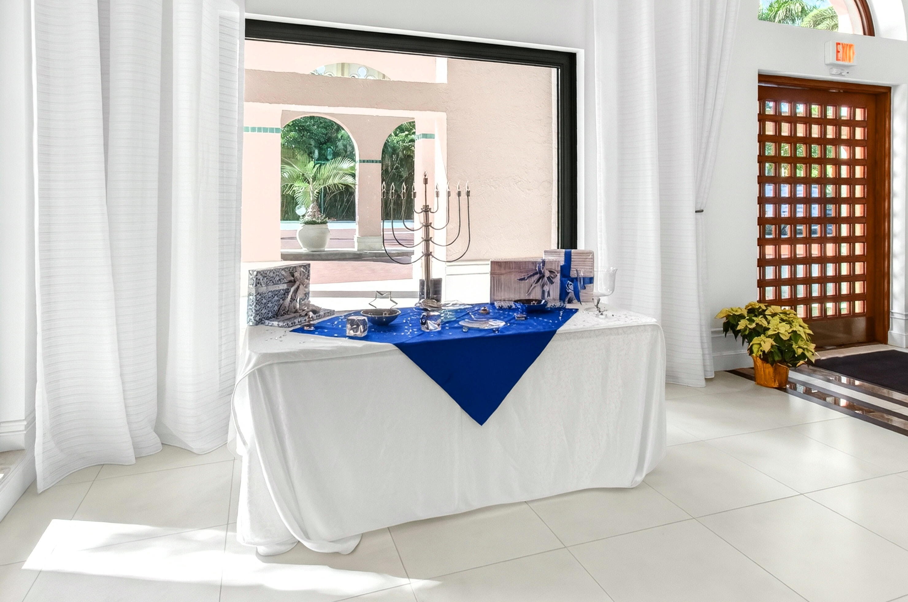 140 Southeast 5th Avenue, Unit 448 Boca Raton, FL 33432 - Photo 39 of 43 a living room with a large window and furniture