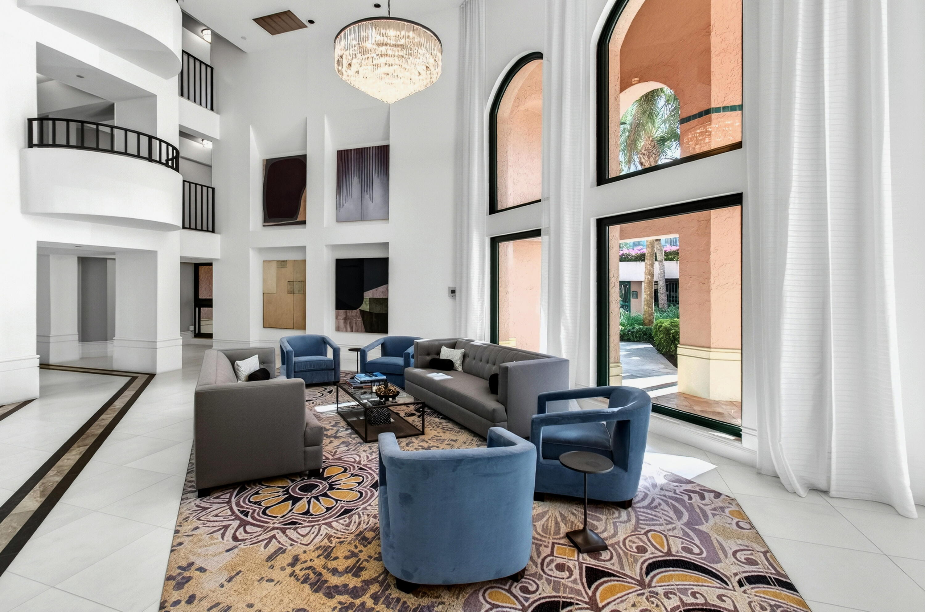 140 Southeast 5th Avenue, Unit 448 Boca Raton, FL 33432 - Photo 4 of 43 a living room with fireplace furniture and a large window