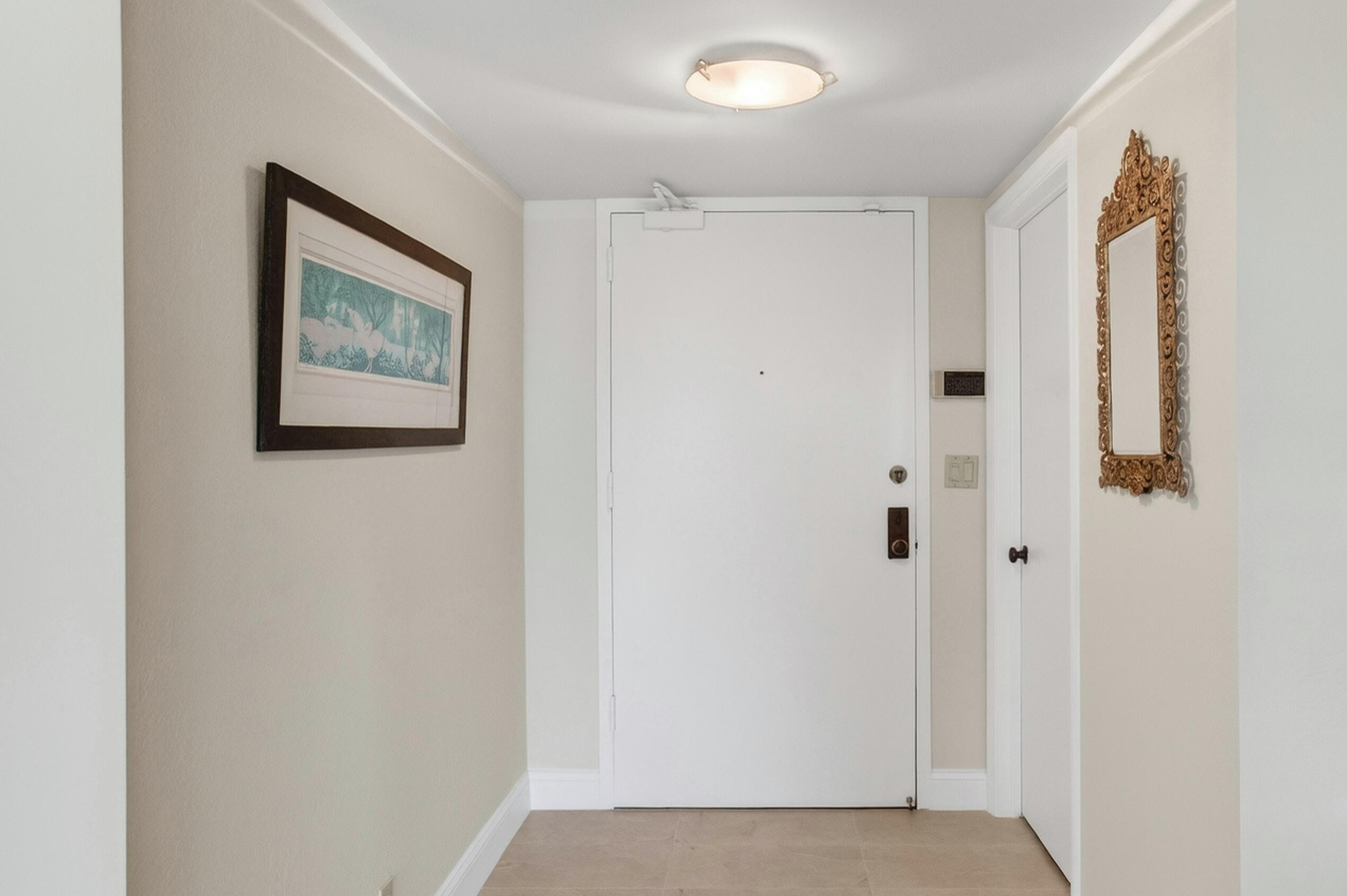 140 Southeast 5th Avenue, Unit 448 Boca Raton, FL 33432 - Photo 6 of 43 a view of a hallway with closet