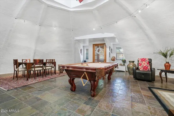 an aerial view of residential house and sandy dunes