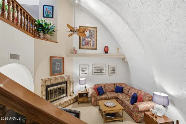 a living room with furniture and a clock