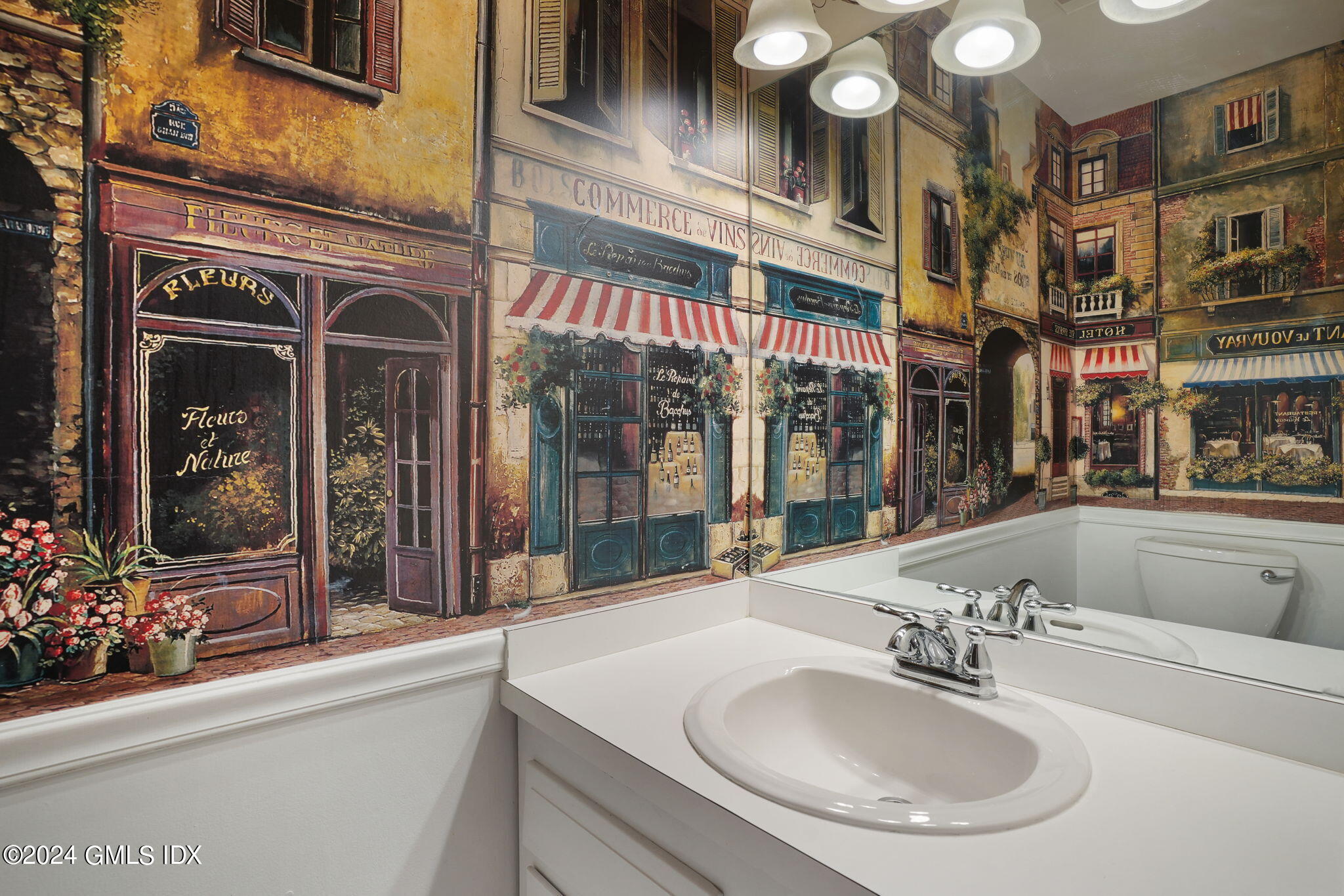 50 Stirrup Lane Riverside, CT 06878 - Photo 13 of 48 a bathroom with a sink and a mirror