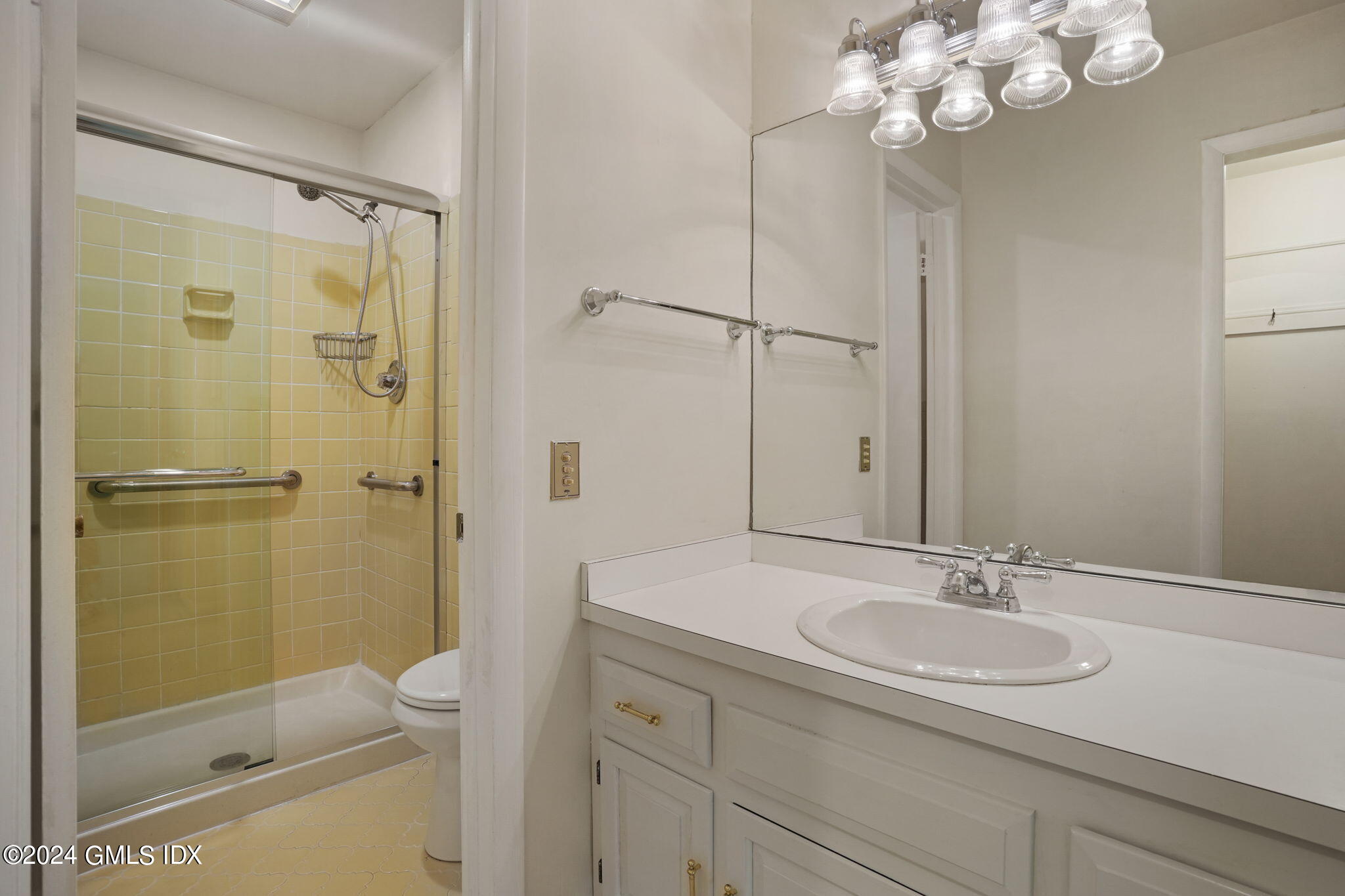 50 Stirrup Lane Riverside, CT 06878 - Photo 23 of 48 a bathroom with a sink a toilet and shower