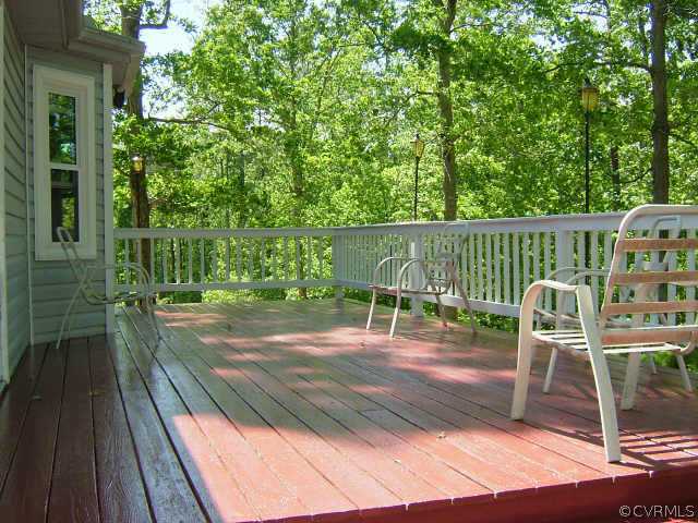 650 Edgar Road Hanover, VA 23069 - Photo 3 of 10 a view of a chairs and table on the wooden deck