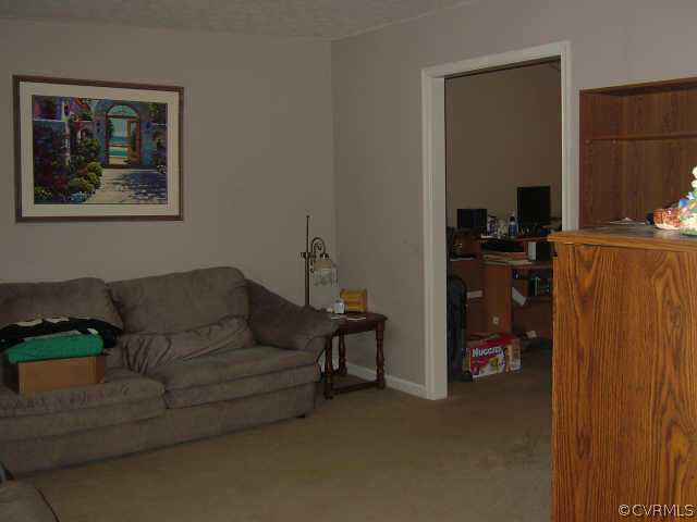 650 Edgar Road Hanover, VA 23069 - Photo 4 of 10 a living room with furniture and a mirror