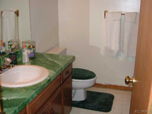 650 Edgar Road Hanover, VA 23069 - Photo 5 of 10 a bathroom with a sink a toilet and a mirror