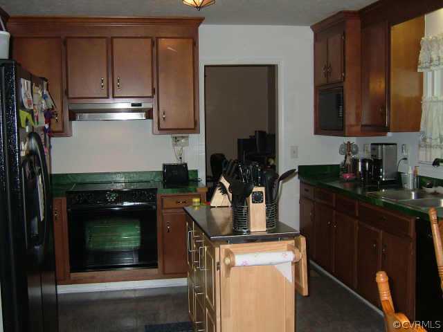 650 Edgar Road Hanover, VA 23069 - Photo 7 of 10 a kitchen with a stove and a microwave