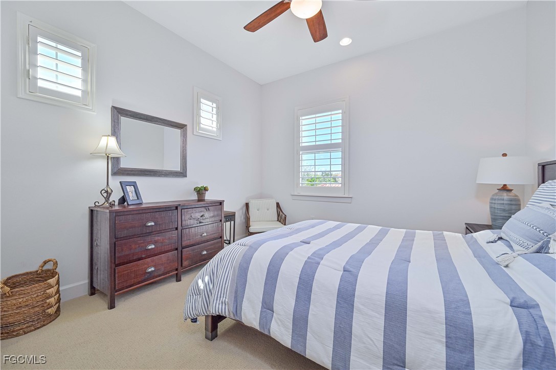 10251 Glastonbury Circle, Unit 201 Fort Myers, FL 33913 - Photo 15 of 45 a bedroom with a bed and a window
