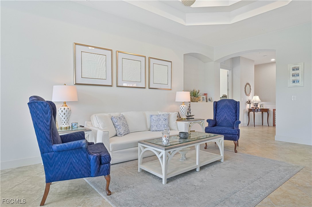 10251 Glastonbury Circle, Unit 201 Fort Myers, FL 33913 - Photo 25 of 45 a living room with furniture and a potted plant