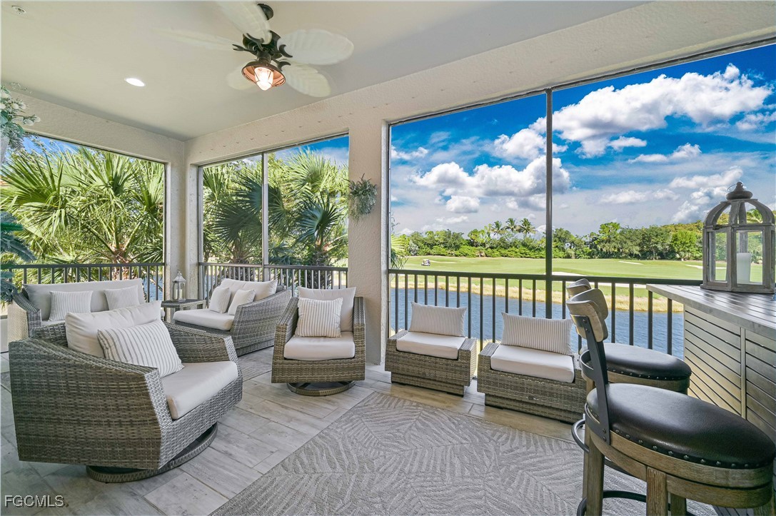 10251 Glastonbury Circle, Unit 201 Fort Myers, FL 33913 - Photo 3 of 45 a balcony with furniture and a view of lake