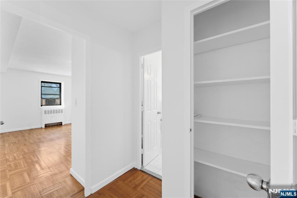 208 Anderson Street, Unit S2A Hackensack, NJ 07601 - Photo 19 of 23 a view of a bedroom with wooden floor