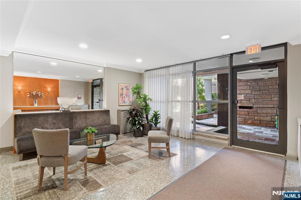 208 Anderson Street, Unit S2A Hackensack, NJ 07601 - Photo 20 of 23 a living room with furniture and a potted plant