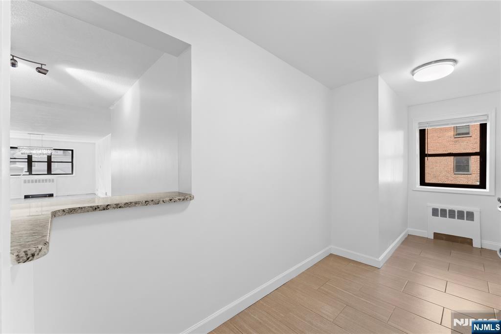 208 Anderson Street, Unit S2A Hackensack, NJ 07601 - Photo 7 of 23 an empty room with a window