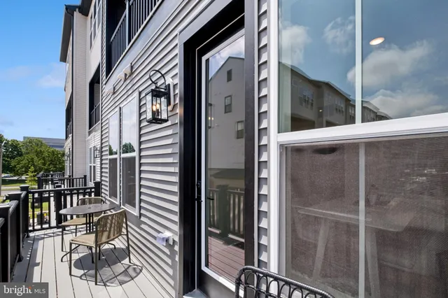 a view of balcony with wooden floor