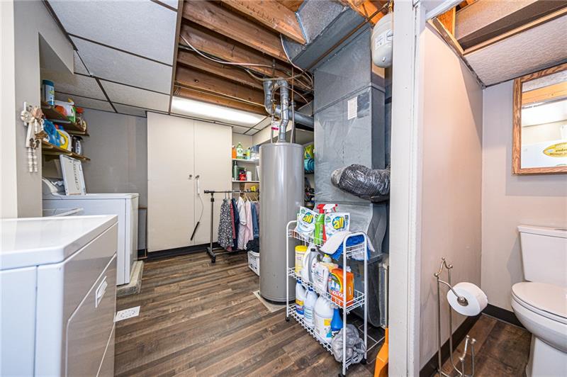 37 Quail Hill Road Pittsburgh, PA 15214 - Photo 21 of 24 LAUNDRY ROOM INCLUDES NEW FLOORING, NEW PITTSBURGH POTTY, BUILT IN CLOSETS, SHELVES, WASHER AND DRYER