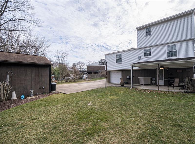37 Quail Hill Road Pittsburgh, PA 15214 - Photo 22 of 24 ENTERTAIN ON THE COVERED PATIO AND LEVEL YARD