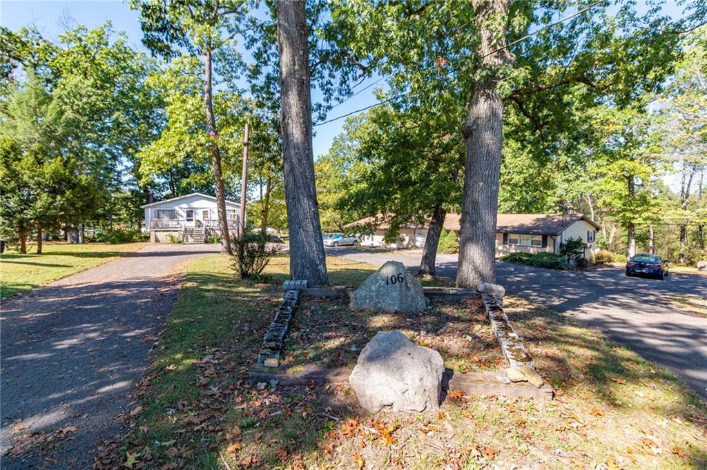 a view of a park with large trees