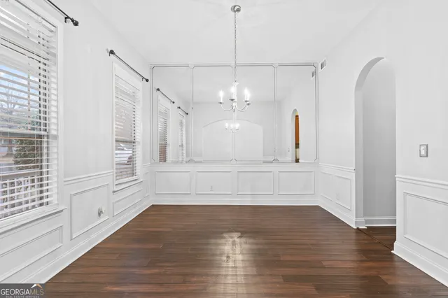 a view of a room with window and wooden floor