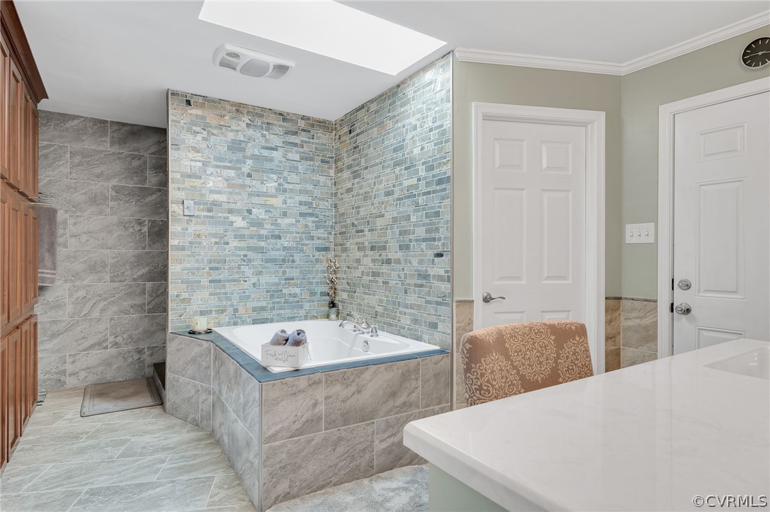 4500 Crossgate Road Chester, VA 23831 - Photo 28 of 50 a bathroom with a bathtub and a sink
