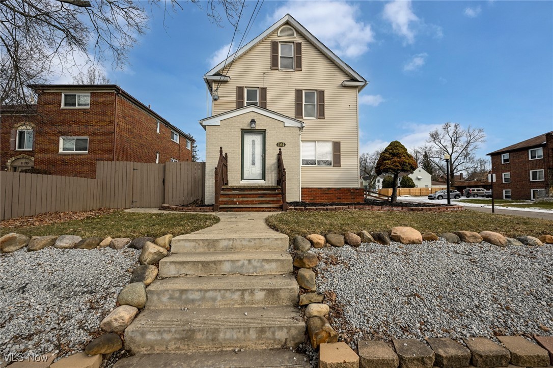 1164 Copley Road Akron, OH 44320 - Photo 1 of 50 Traditional home with brick siding and fence