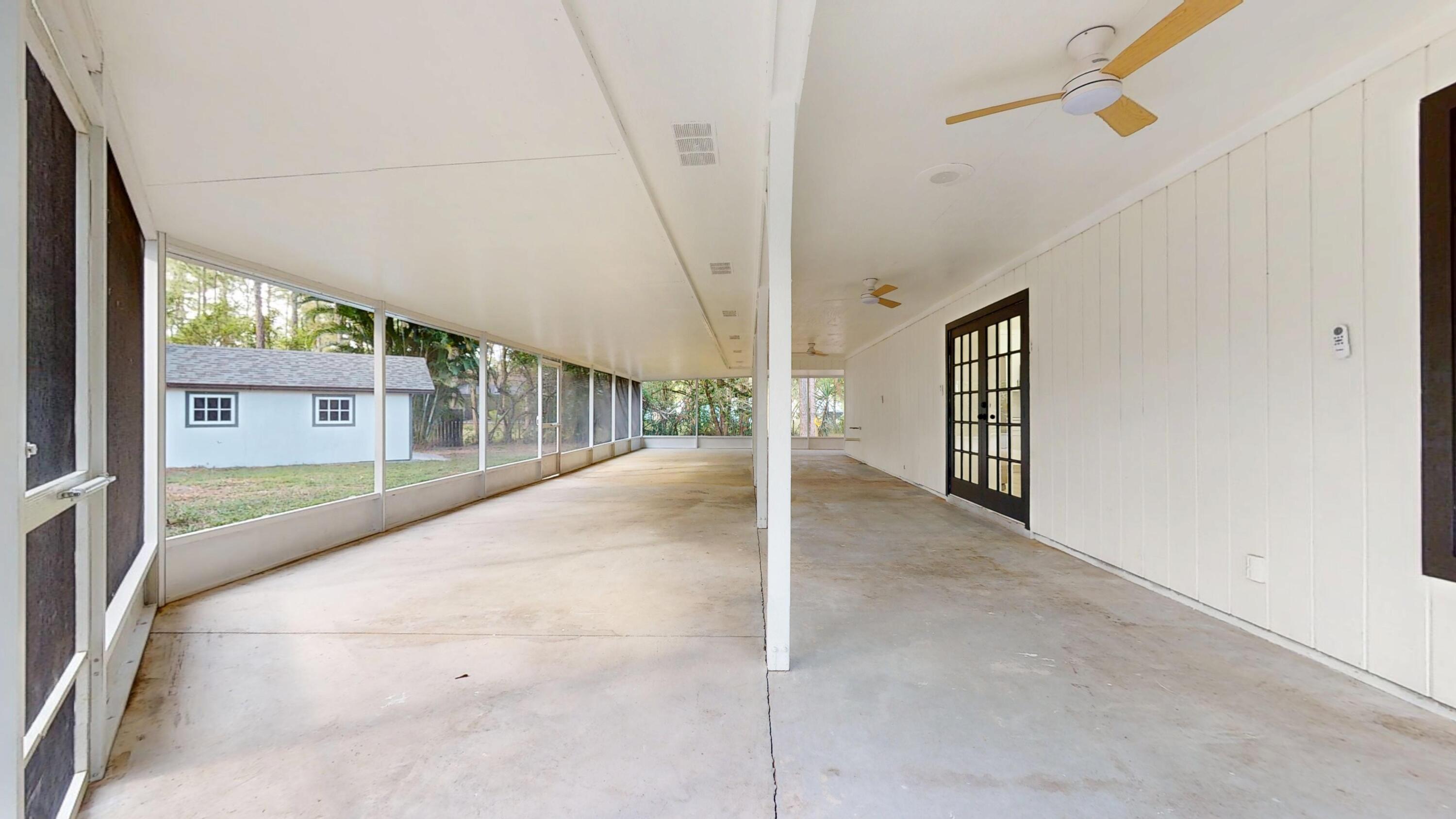 13018 153rd Road North Jupiter, FL 33478 - Photo 12 of 37 a view of a hallway with window