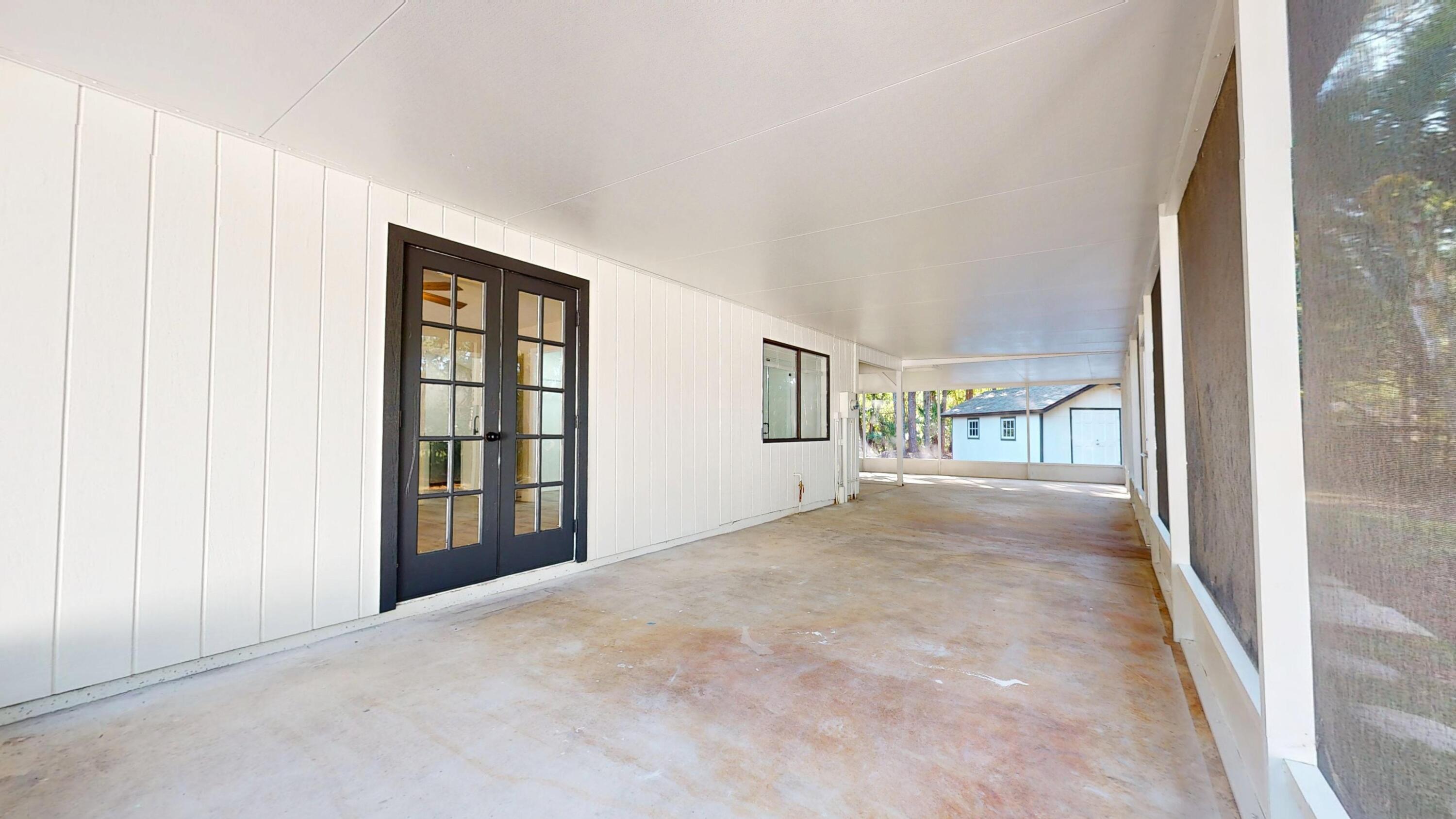 13018 153rd Road North Jupiter, FL 33478 - Photo 13 of 37 a view of an empty room with a window