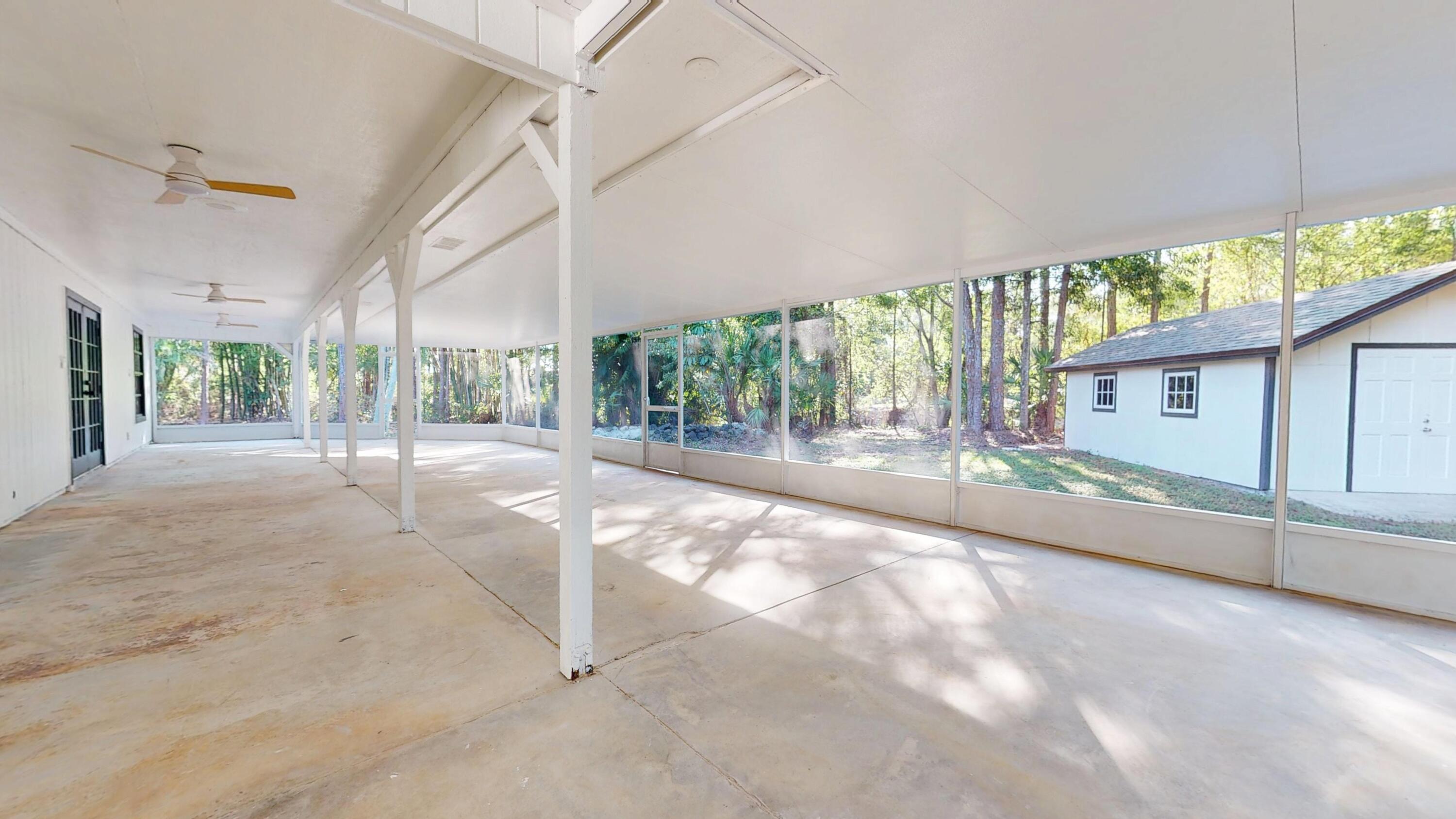 13018 153rd Road North Jupiter, FL 33478 - Photo 15 of 37 a view of an empty room with a balcony
