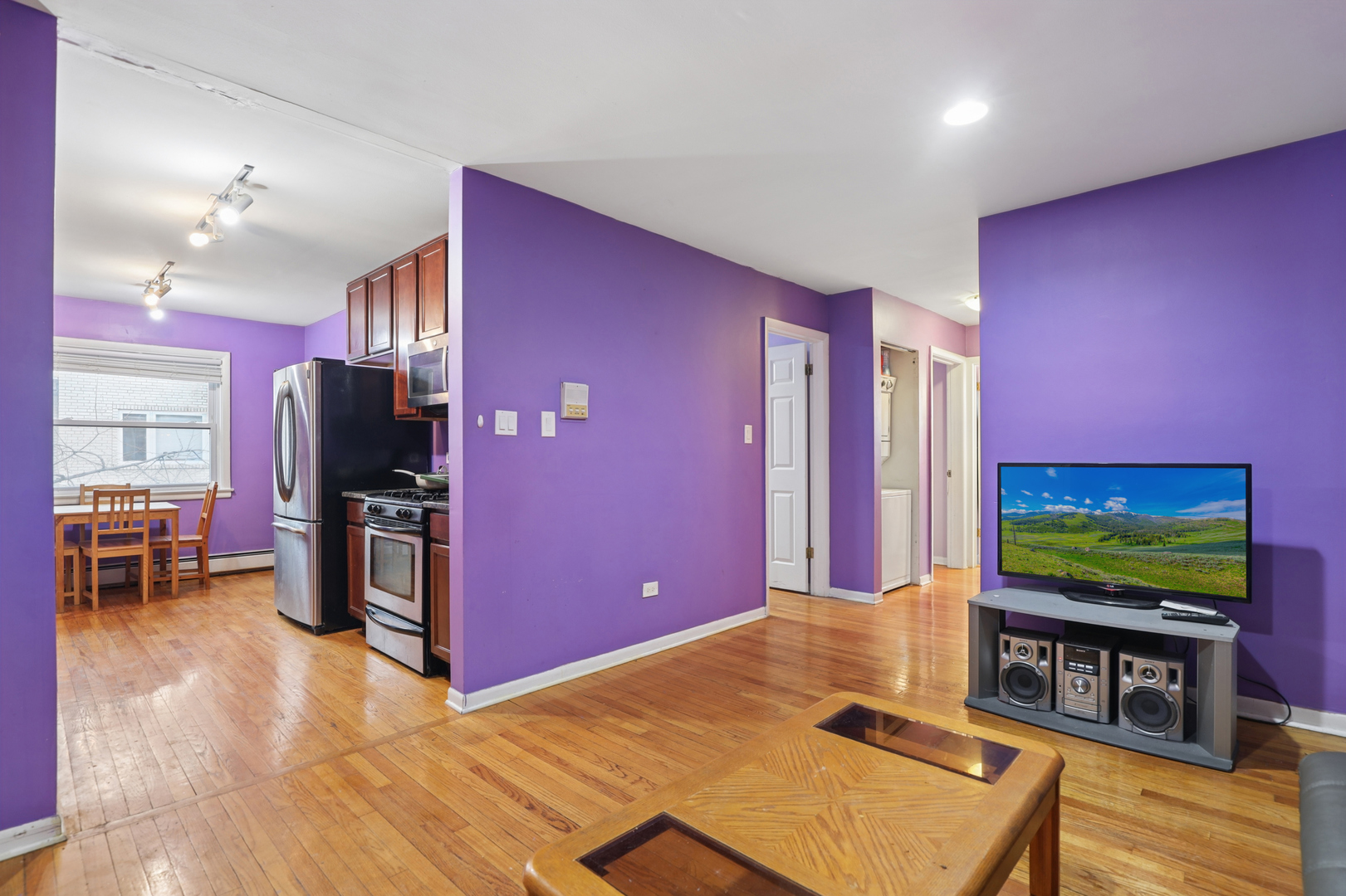 2147 Ridge Avenue, Unit 2D Evanston, IL 60201 - Photo 6 of 22 a living room with flat screen tv