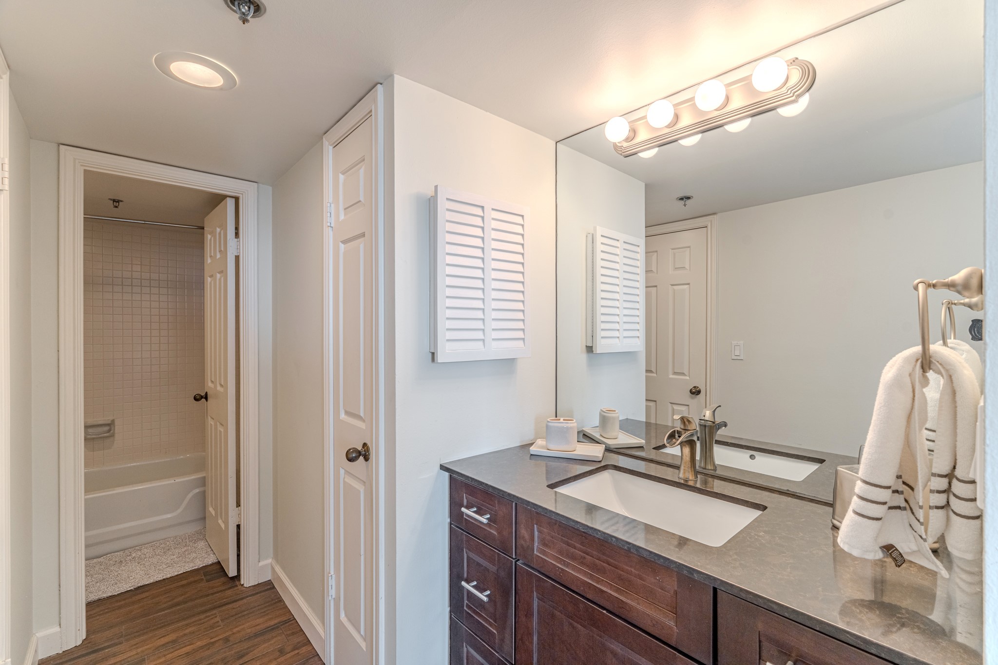 3525 Sage Road, Unit 1016 Houston, TX 77056 - Photo 36 of 42 a bathroom with a sink double vanity and a mirror